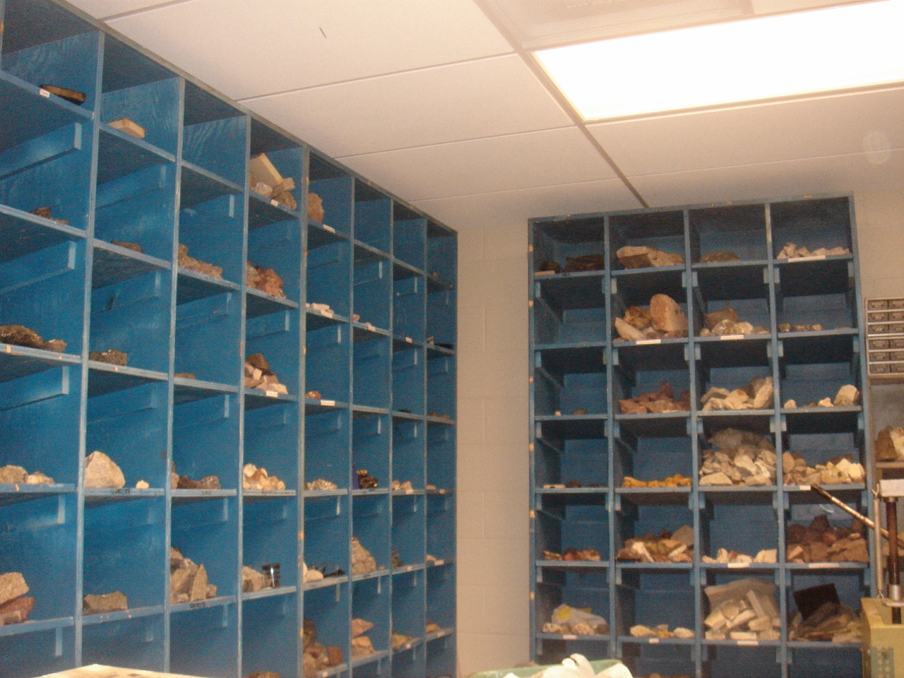 floor to ceiling bins holding rock samples for classroom use