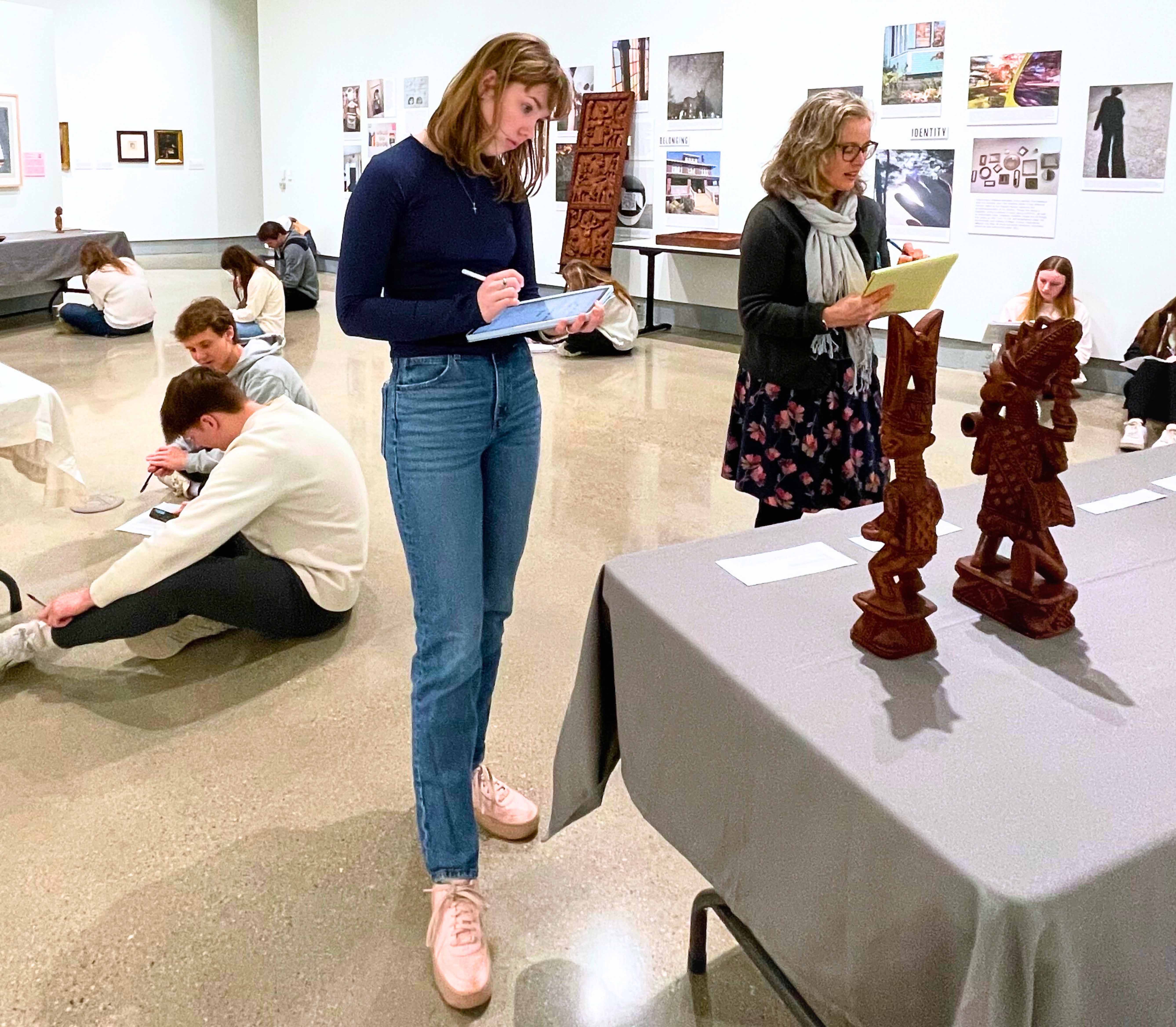 Hope College class examining art at the KAM