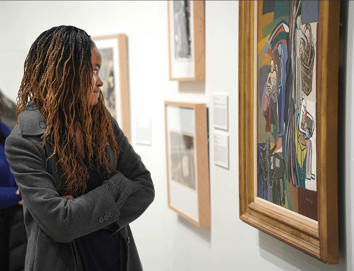 Hope College student looking at artwork in the musuem