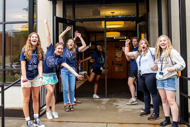 Awakening interns welcoming students to campus