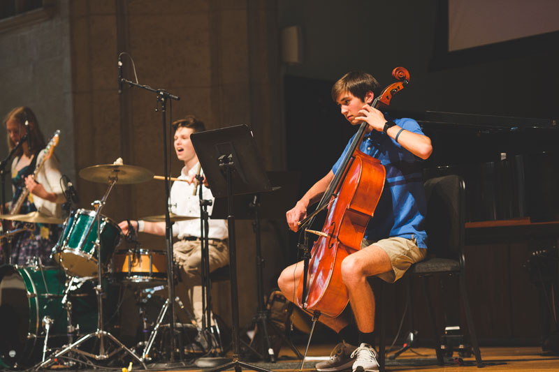 Students performing on stage at Awakening