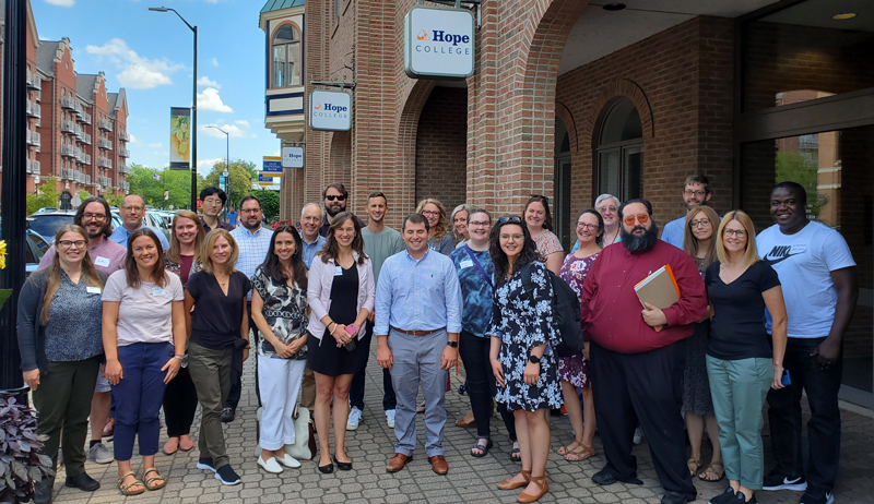 2022 Initium faculty in a group on 8th Street