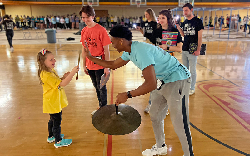 Dance Marathon team and a Miracle Child