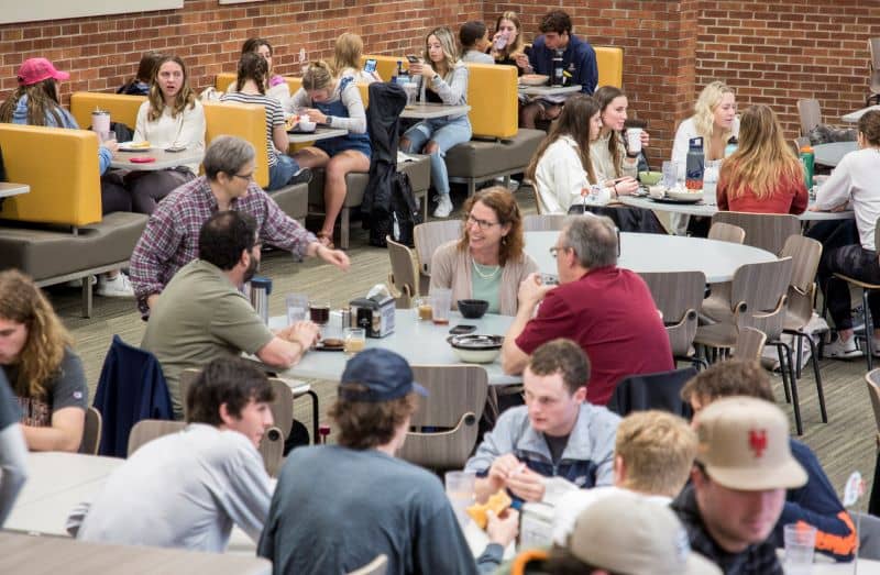 a group of faculty eating lunch at Phelps Dining Hall.